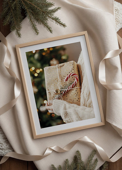 a picture of a person holding a wrapped present